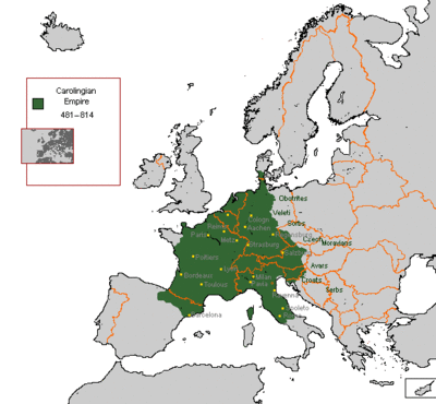 Which mountain range did the Carolingian Empire cross in the south?