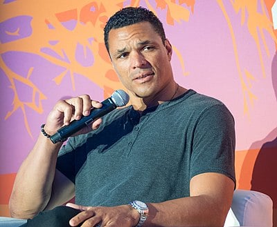 Against which team did Tony Gonzalez score his first NFL touchdown?