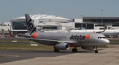 What type of airlines does Qantas have stakes in through the Jetstar Group?