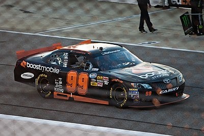 In what series did Travis make his NASCAR Cup debut?