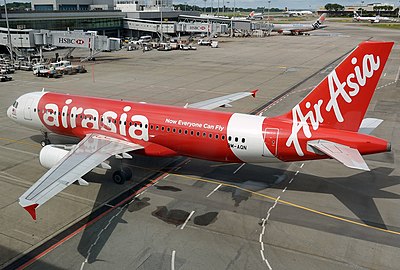 What is the full name of AirAsia's parent company?