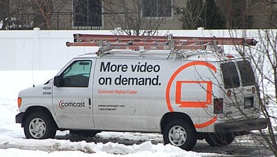 What is the name of Comcast's video-on-demand streaming service?