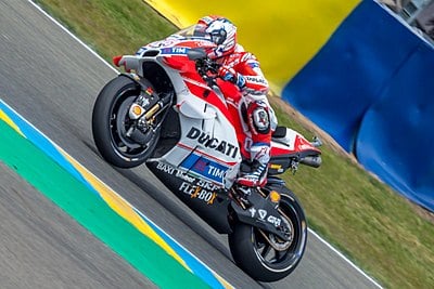 How many MotoGP seasons has Dovizioso finished in the top five in 13 years?