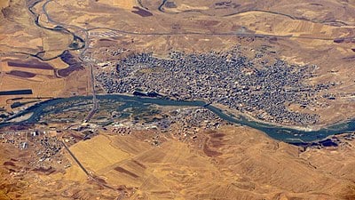 Which two religious communities had a significant presence in Cizre by the 12th century?