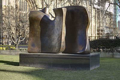 Henry Moore's sculptures typically feature which two figures?