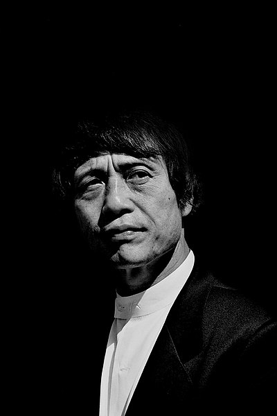 Tadao Ando’s architectural works emphasize a strong relation between?