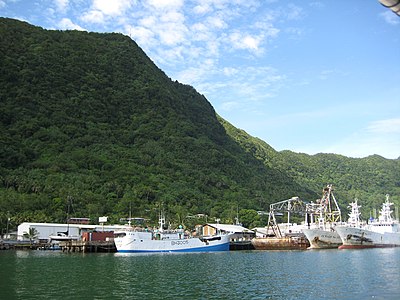 What is the name of the mountain that protects Pago Pago's harbor?