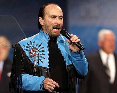 What instrument does Lee Greenwood play?