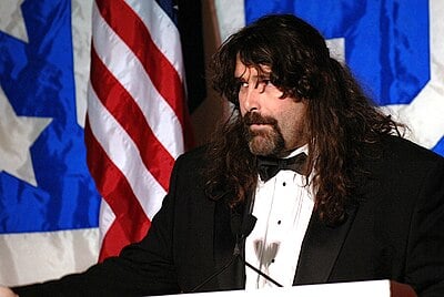 What is the name of Mick Foley's hippie persona?