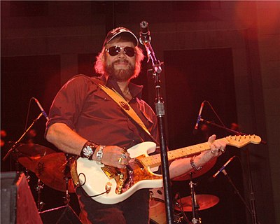 What is the title of Hank Jr.'s most famous song concerning his friends?