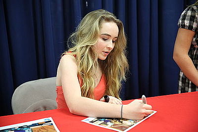 What record label did Sabrina sign with in 2014?