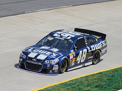 Which team did Jimmie Johnson race for during his seven championship seasons?