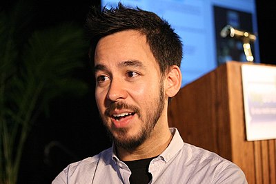 What instrument does Mike Shinoda NOT typically play?