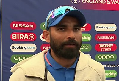 Does Mohammed Shami bowl with his left or right arm?
