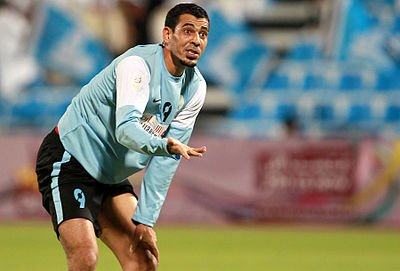 Which team did Younis Mahmoud first score an international goal against in 2002?