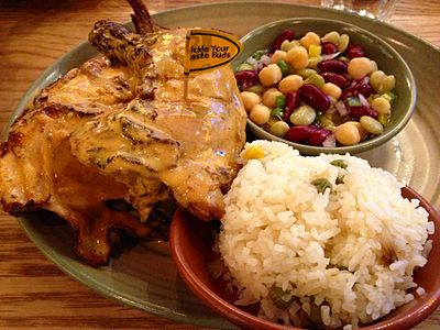In what year did Nando's open its first restaurant outside of South Africa?