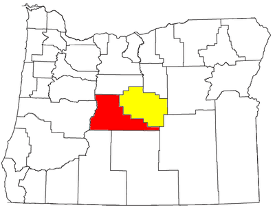 Where is Bend located in relation to the Cascade Range?