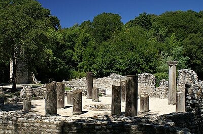 What is the primary language spoken in the region surrounding Butrint?