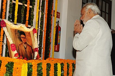 In which year was Savarkar charged as a co-conspirator in the assassination of Mahatma Gandhi?