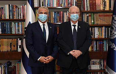 Which month in 2021 did Lapid begin coalition talks?