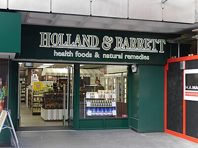 What is the primary focus of Holland & Barrett stores?