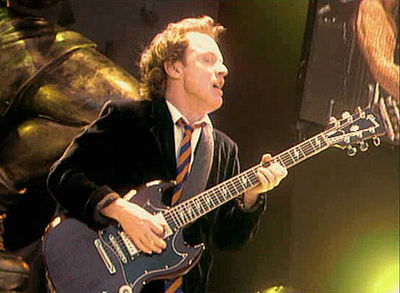 In which band is Angus Young the lead guitarist?
