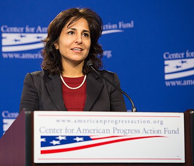 At what age did Neera Tanden begin her political career?