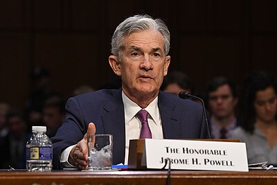 Which policy did Jerome Powell retire after being renominated by President Biden?