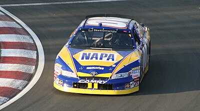 In what year did Carpentier first race full-time in NASCAR?