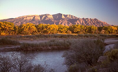 What is the primary language spoken by the Sandia Pueblo people?