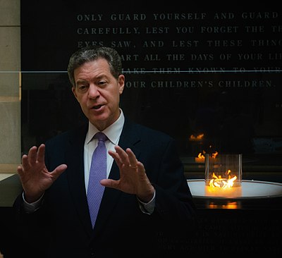 What role did Brownback serve from 2018 to 2021?