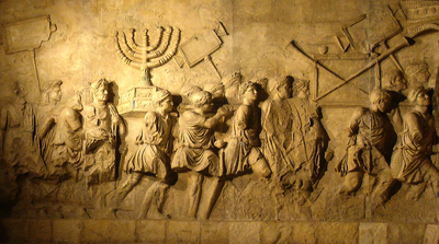 What commemorates Titus' victory against Jerusalem?