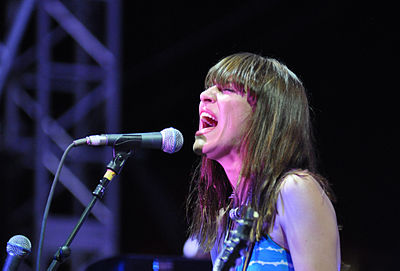 What is the name of the indie rock group Feist is a member of?