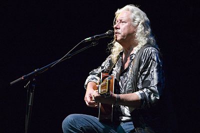 Whose song did Arlo Guthrie perform to get his only top-40 hit?