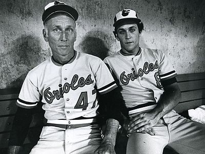 In which year did Cal Ripken Jr. voluntarily end his consecutive games streak?