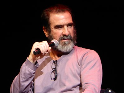 In which year did Eric Cantona retire from professional football?