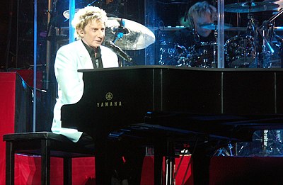 What's the title of Manilow's song that insists he's not the author?