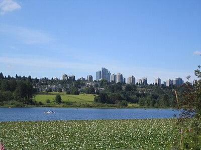 Which river separates Burnaby from New Westminster and Surrey?