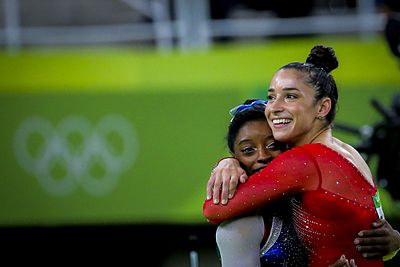 In which years was Aly Raisman the captain of the U.S. women's Olympic gymnastics teams?