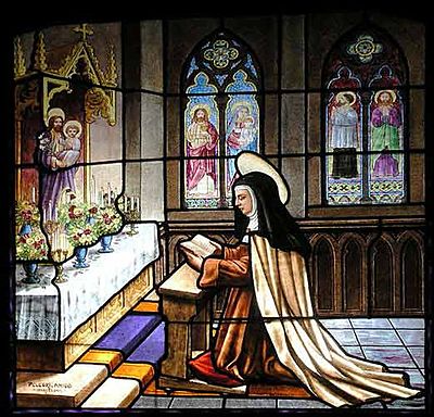 When was Teresa of Ávila canonized as a saint?