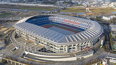 What is the capacity of the Nissan Stadium, home of Yokohama F. Marinos?