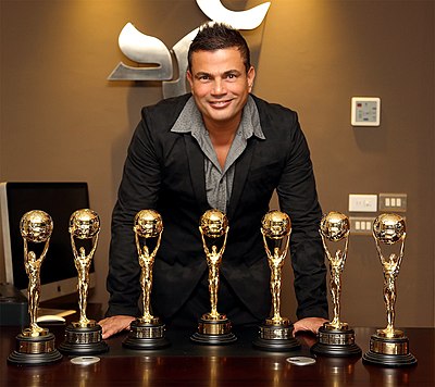 Amr Diab has won awards not only in music but also for what?