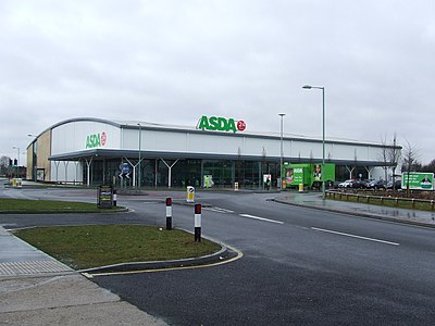 Which supermarket chain's acquisition of Asda was rejected by a regulatory authority?