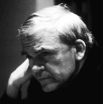 What language did Milan Kundera write in after his exile to France?