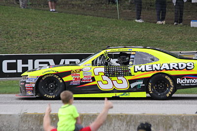 Which team did Paul Menard drive for in 2011?
