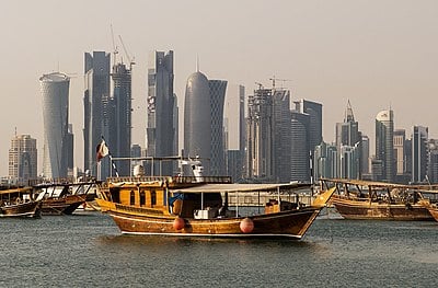 In Qatar, what is the legal age of adulthood?