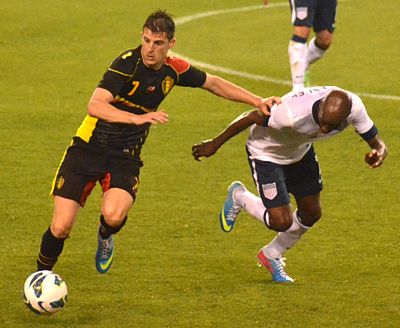 In which year did Mirallas make his debut for Belgium?
