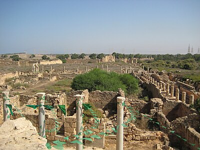 What is the status of the ruins of Leptis Magna today?