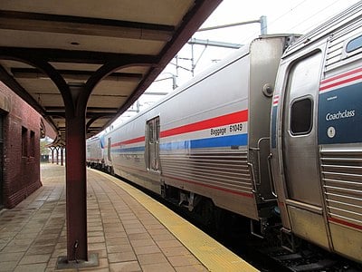 How many miles of track does Amtrak directly own?