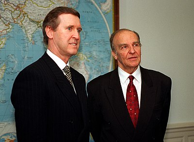With whom did Bosnia and Herzegovina fight a separate war during Izetbegović's tenure?
